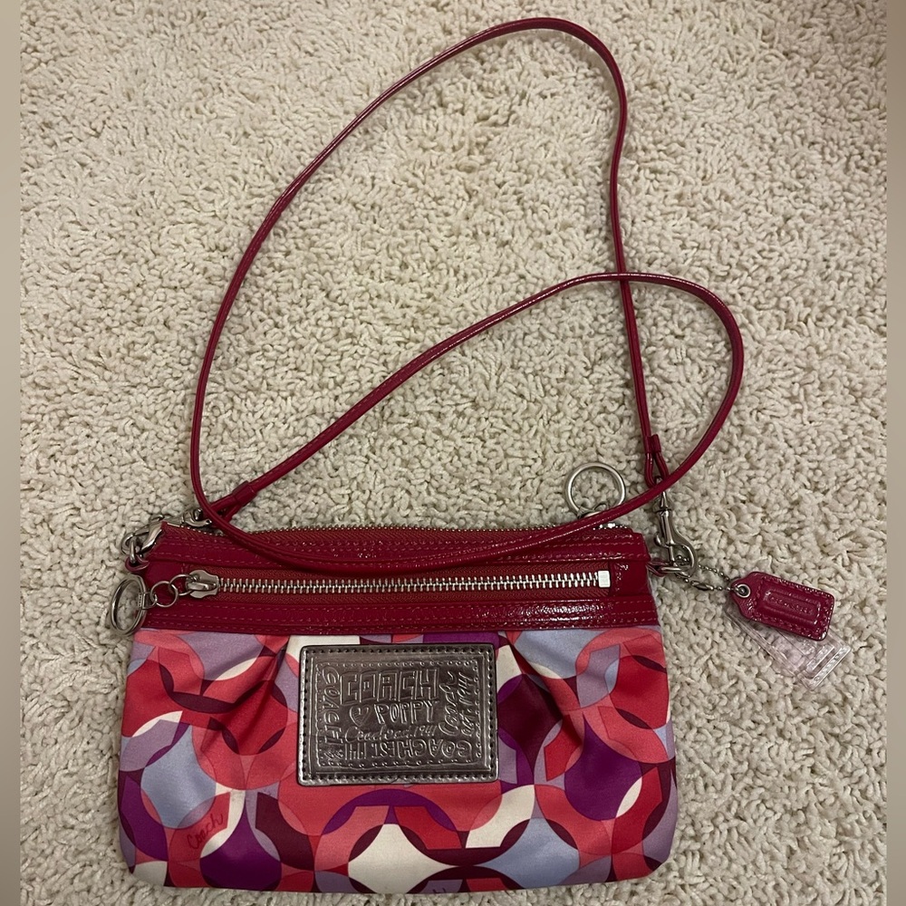 Red and pink Coach crossbody bag